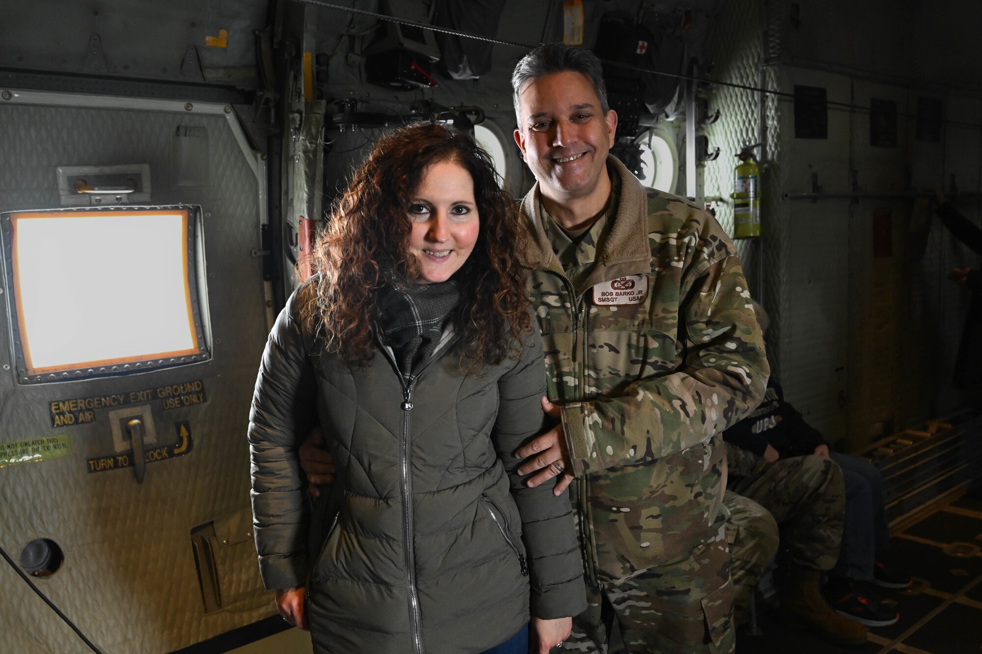 Senior Master Sgt. Bob Barko, Jr., 910th Public Affairs superintendent, poses for a photo with his spouse during an incentive flight over the Allegheny River Valley, Dec. 7, 2024.