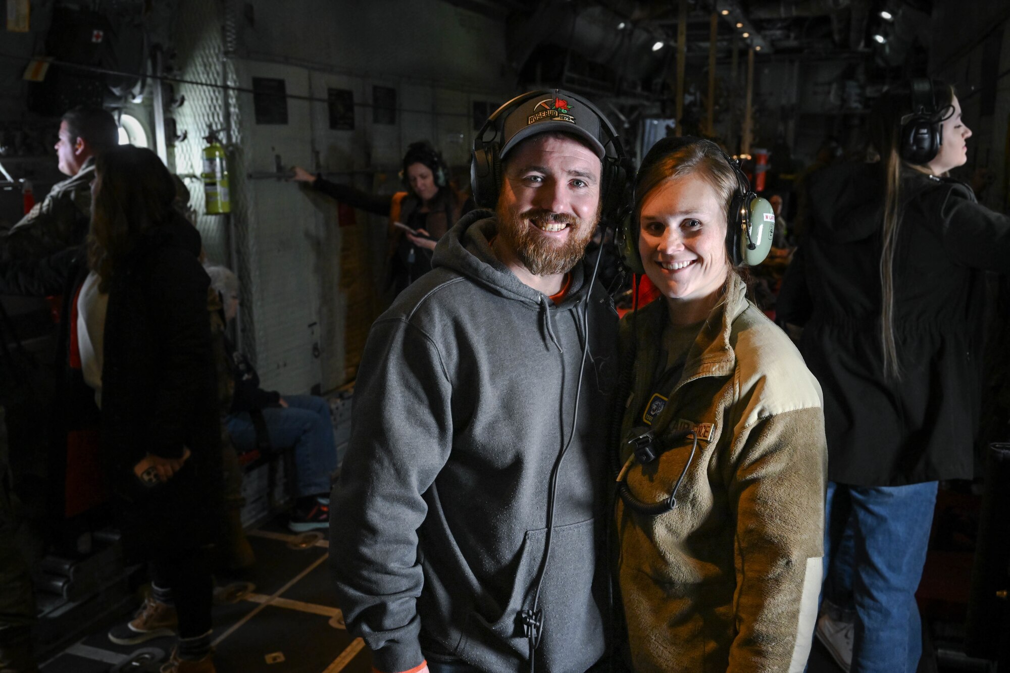 Tech. Sgt. Micaiah McCartney, a loadmaster with the 757th Airlift Squadron, poses for a photo with her spouse during an incentive flight over the Allegheny River Valley, Dec. 7, 2024.