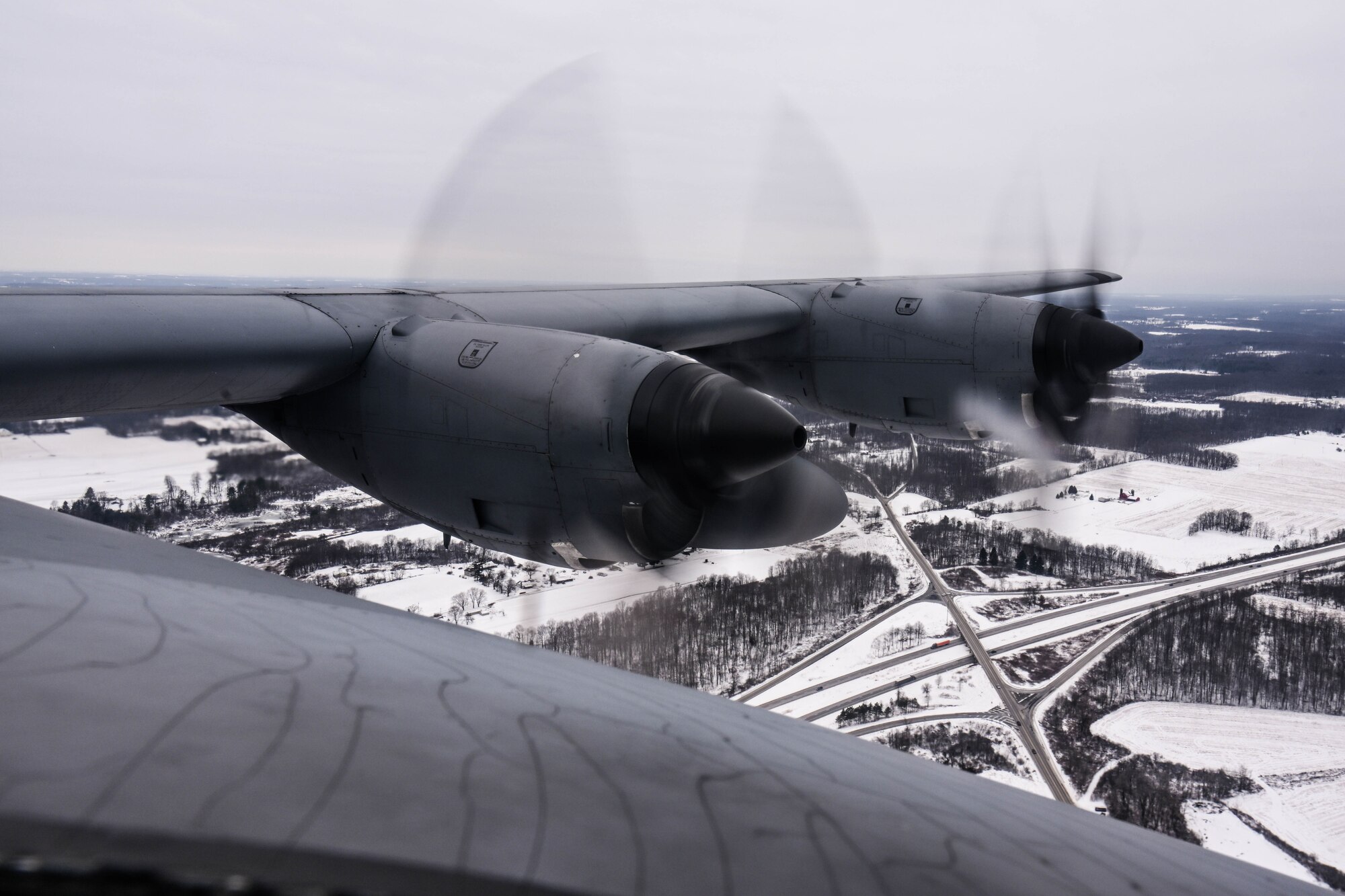 A C-130H Hercules flies over the Allegheny River Valley during an incentive flight for spouses, Dec. 7, 2024.
