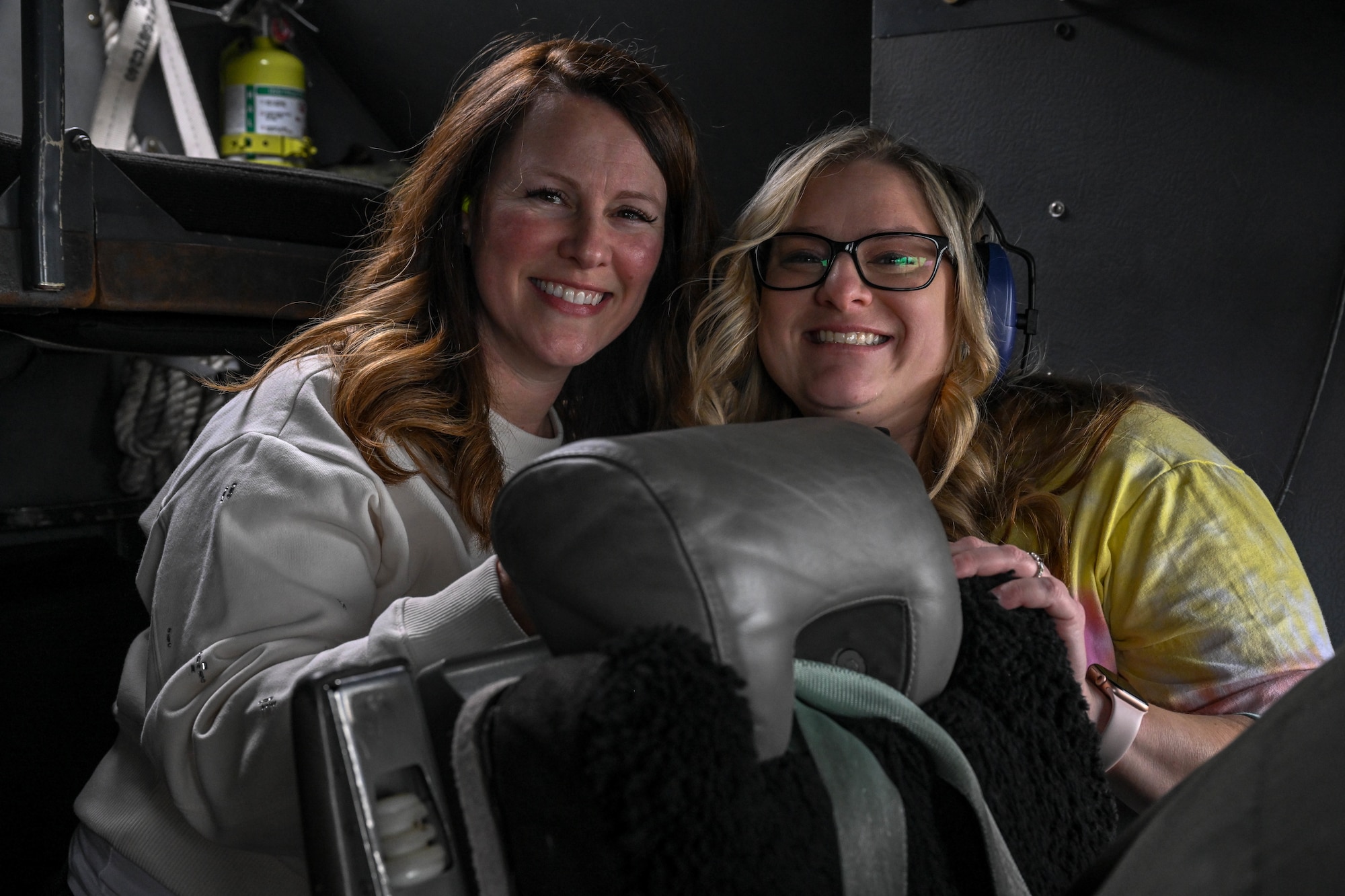 Spouses of 910th Airlift Wing Airmen pose for a photo during an incentive flight, Dec. 7, 2024.