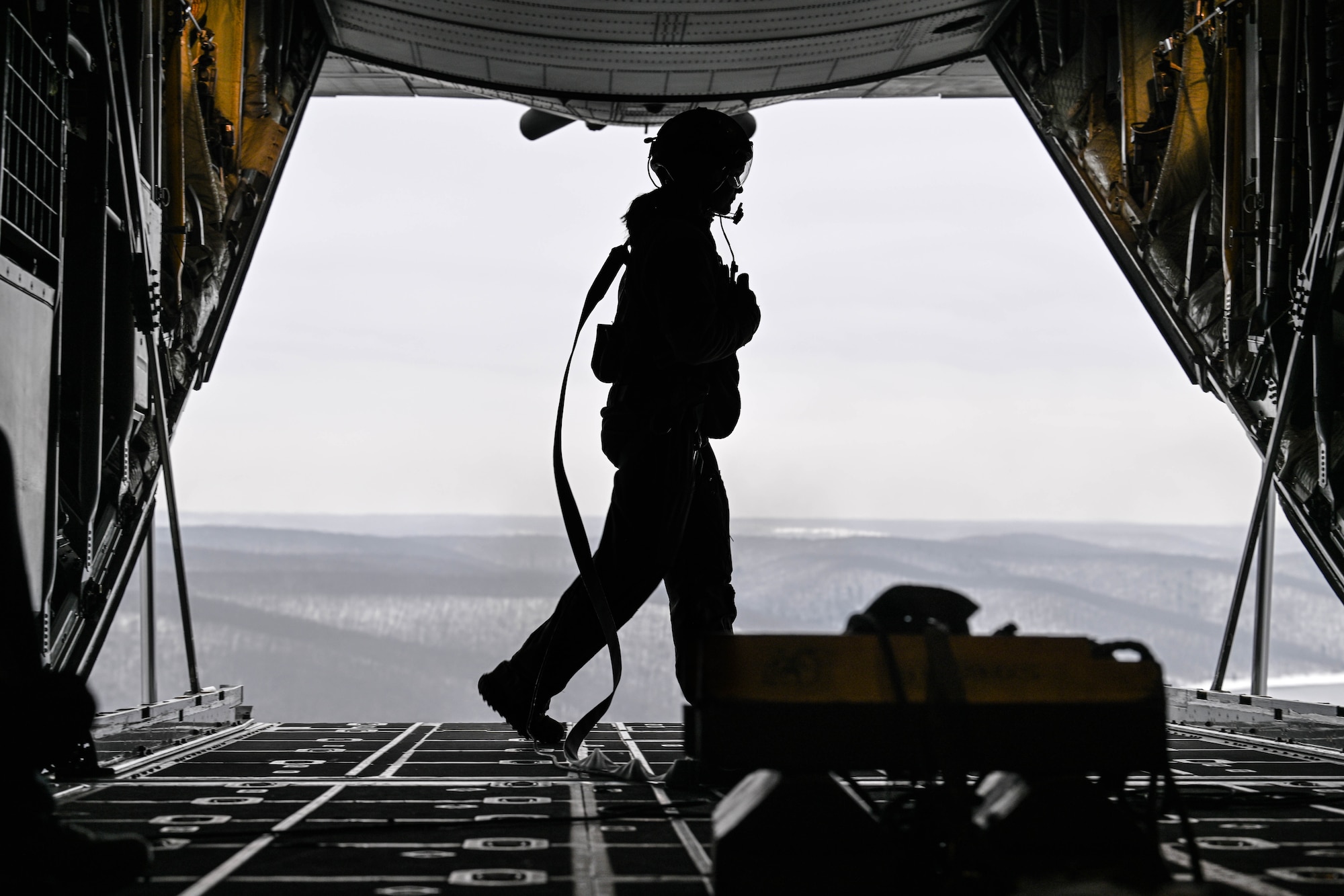 Tech. Sgt. Micaiah McCartney, a loadmaster with the 757th Airlift Squadron, walks on the ramp of a C-130H Hercules during an incentive flight for spouses, Dec. 7, 2024.