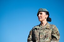 woman in uniform poses