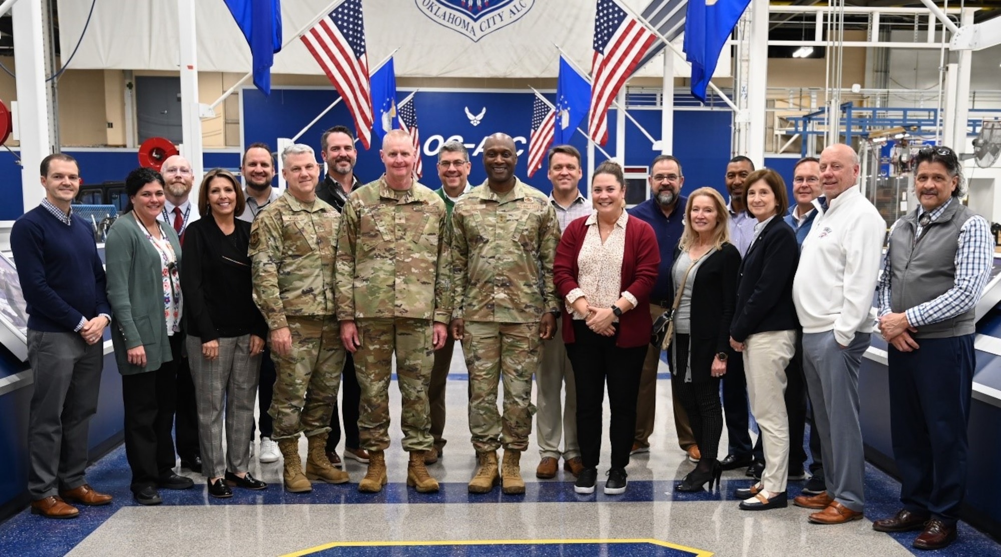 several men and women standing next to each other
