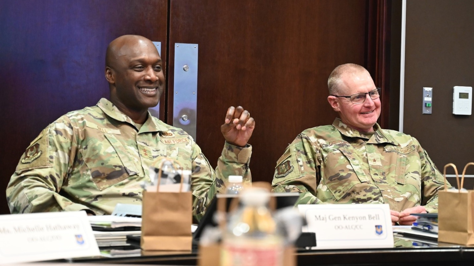 two men sitting at a table