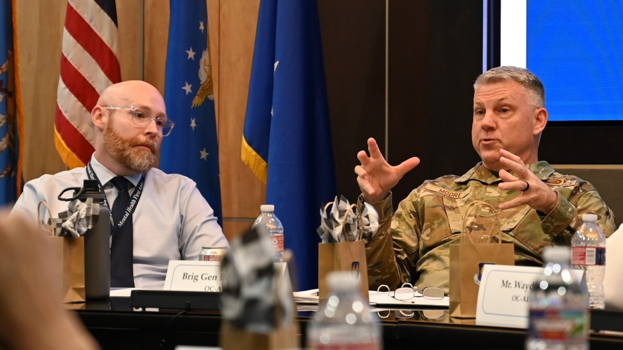 two men sitting at a table