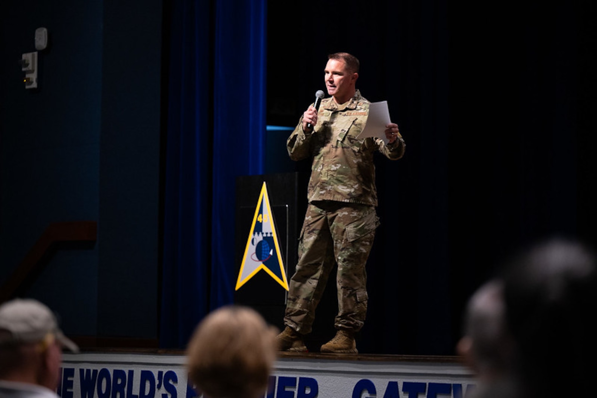Col. Josh Peter, 45th Medical Group commander, addresses audience members during a town hall meeting.