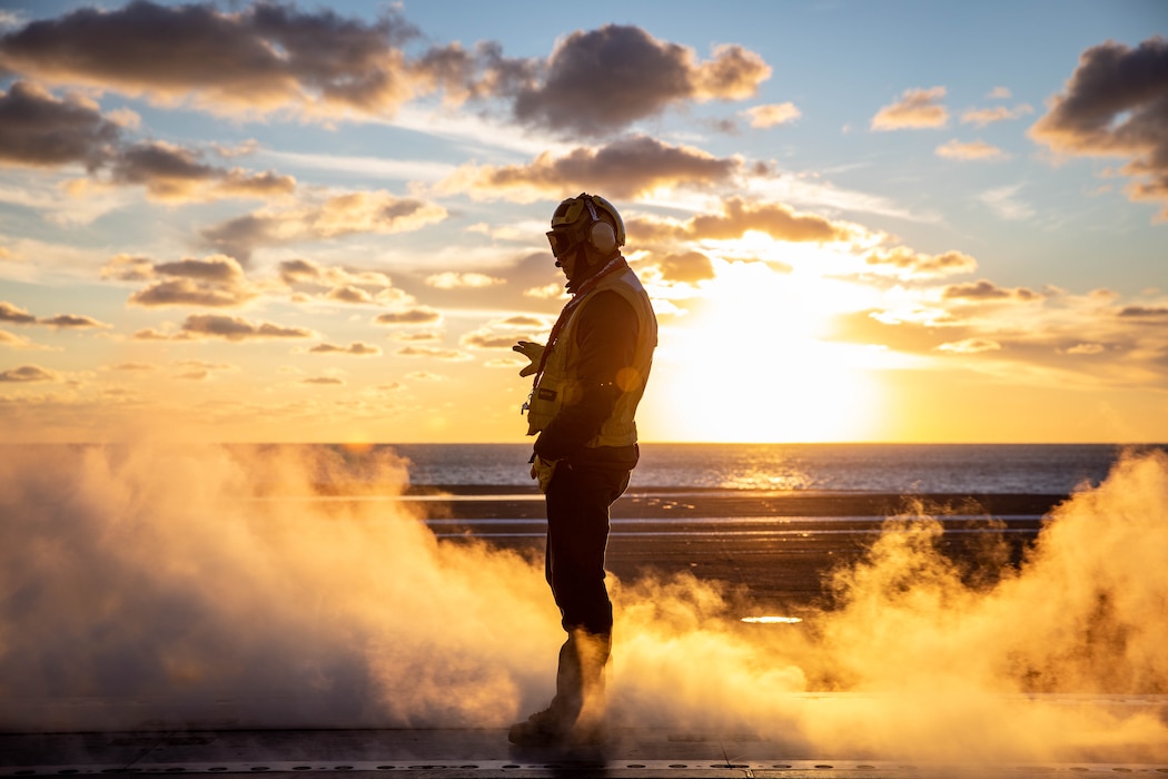 BMH3 Juan MalaveArroyo directs aircraft aboard USS George H.W. Bush (CVN 77) in the Atlantic Ocean.