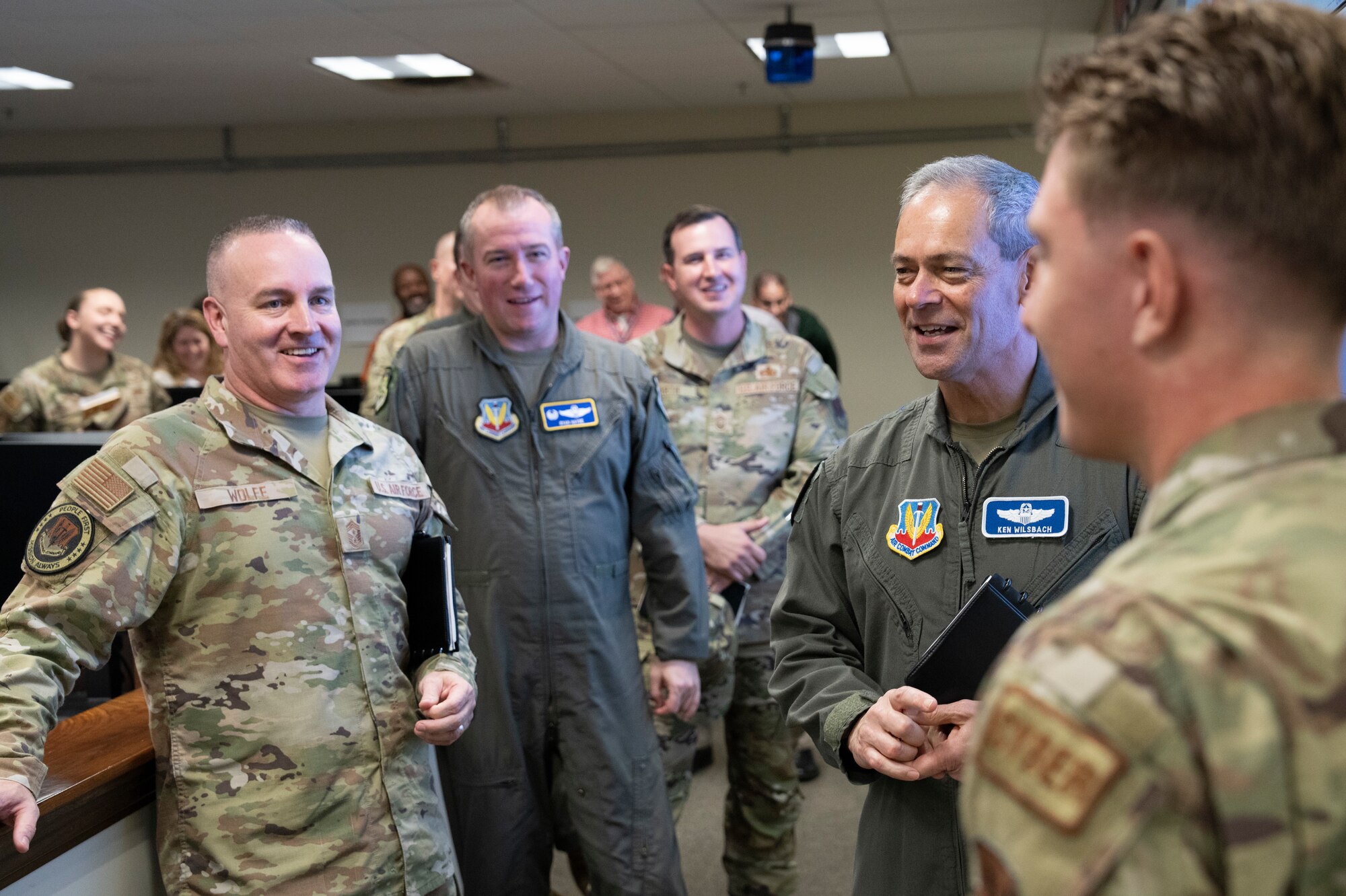 photo of uniformed U.S. Air Force Airmen standing in a room