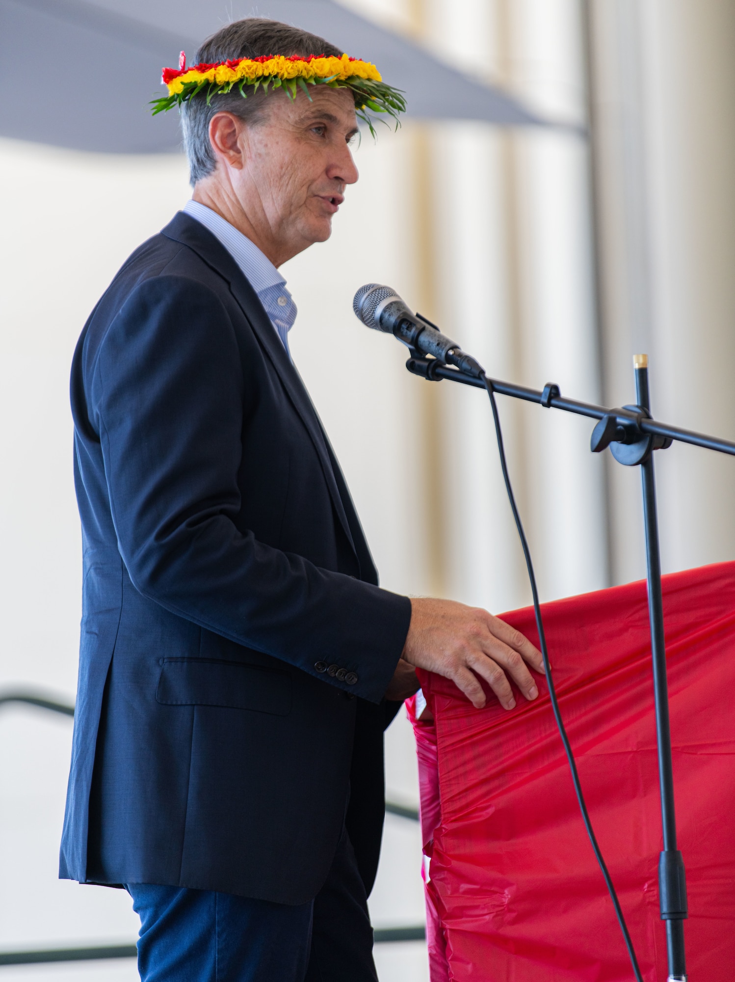 Vincent Mut-Tracy, Deputy Chief of Mission at the U.S. Embassy in the Federated States of Micronesia, addresses attendees of the Operation Christmas Drop 2024 “Push Ceremony” at Andersen Air Force Base, Guam, Dec. 9, 2024.