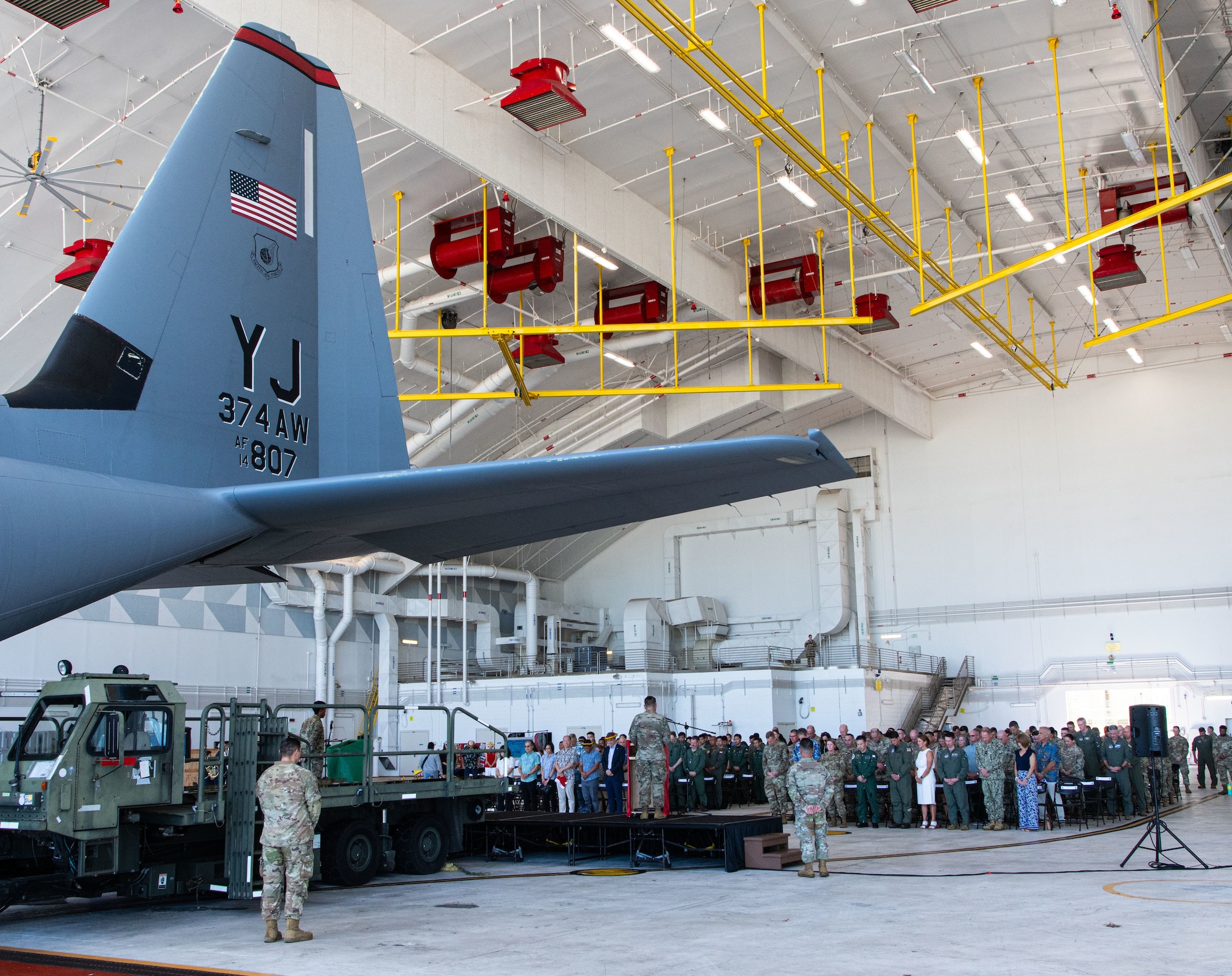 Attendees stand during the Operation Christmas Drop 2024 “Push Ceremony” at Andersen Air Force Base, Guam, Dec. 9, 2024.