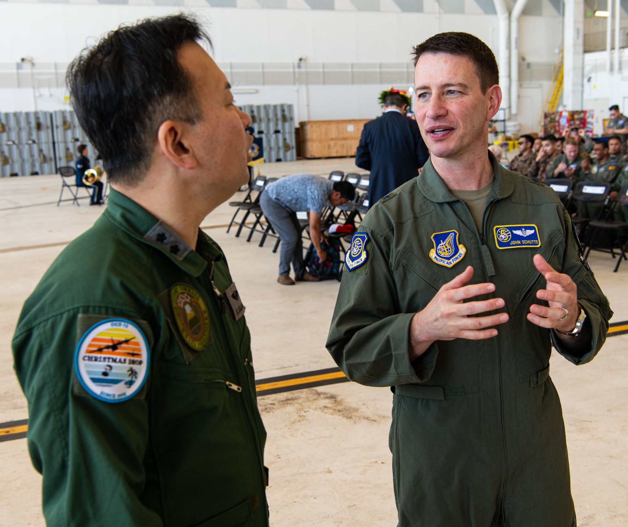 Air Vice-Marshal Carl Newman, the Pacific Air Forces deputy commander and the Deputy Theater Air Component Commander to the Commander, U.S. Indo-Pacific Command, speaks with Rear Admiral Gregory Huffman, commander of Joint Task Force - Micronesia, during the Operation Christmas Drop 2024 “Push Ceremony” at Andersen Air Force Base, Guam, Dec. 9, 2024.