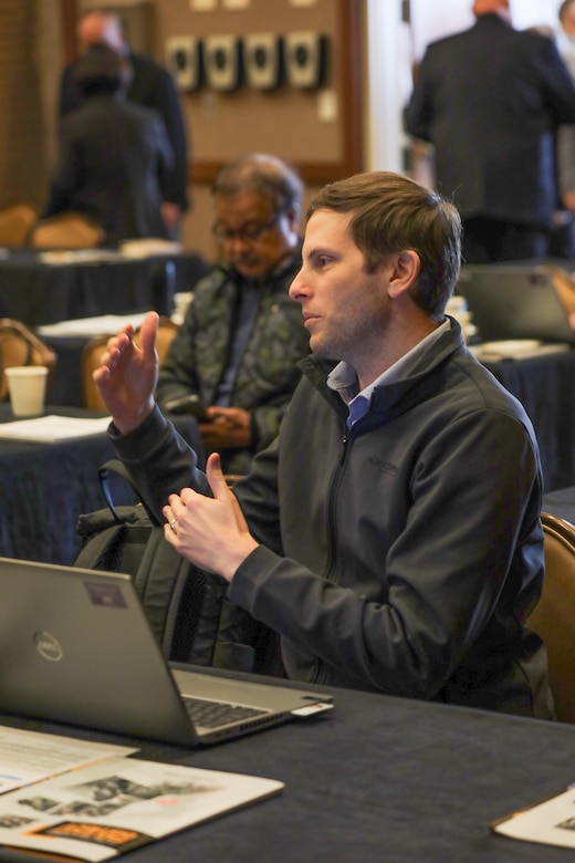 Brent Cohen, Resident Engineer at the Central Resident Office, U.S. Army Corps of Engineers – Far East District, engages in conversations during break helping forward the dialogue on measuring and enhancing quality at the Engineering Quality Symposium from Nov. 13-14, 2024, at Camp Humphreys, South Korea. (U.S. Army photo by Monique Freemon)