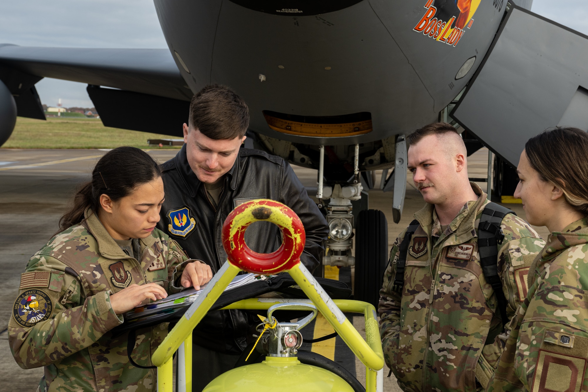 U.S. Airmen assigned to the 351st Air Refueling Squadron conduct a pre-flight briefing prior to participating in a Trilateral Bomber Task Force support mission at Royal Air Force Mildenhall, England, Dec. 3, 2024.