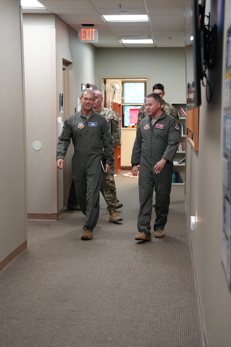 photo of uniformed U.S. Air Force Airmen walking down a hallway