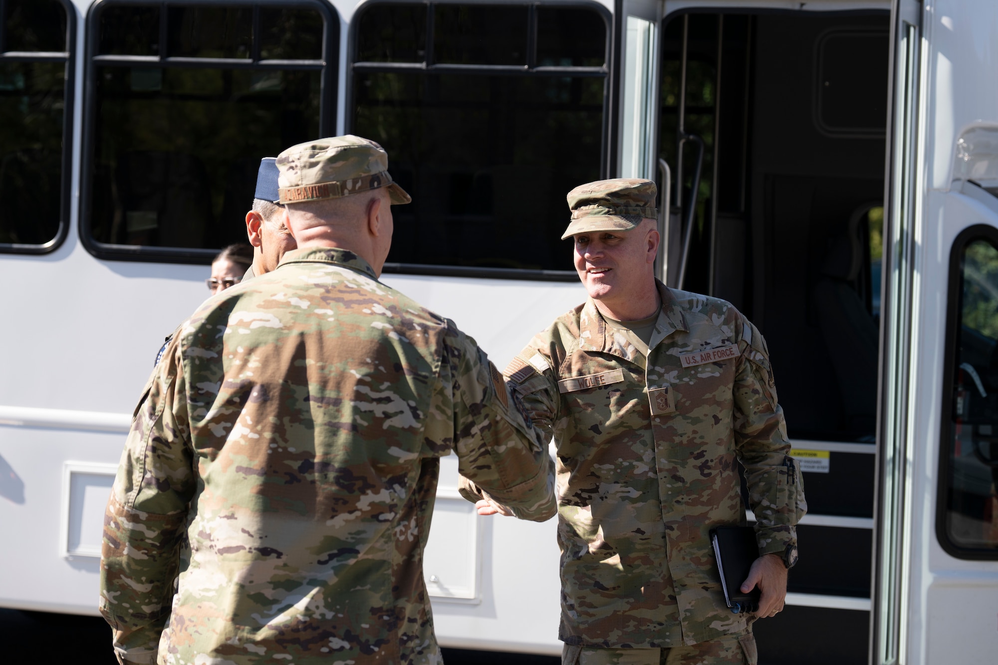photo of uniformed U.S. Air Force Airmen shaking hands
