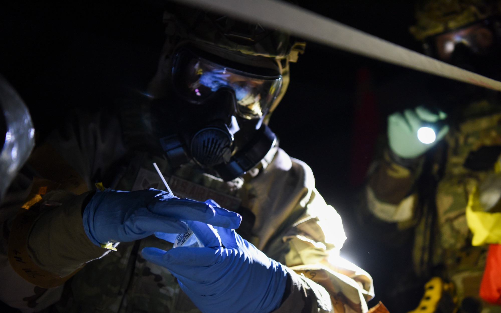 U.S. Air Force Staff Sgt. Philip Schopmeyer, 100th Civil Engineer Squadron emergency management journeyman, takes a sample of a simulated narcotic during a Prime Base Engineer Emergency Force (Prime BEEF) readiness day at Royal Air Force Mildenhall, England, Nov. 21, 2024.