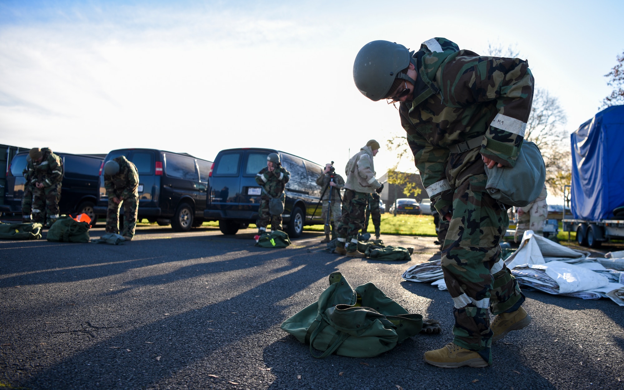 U.S. Airmen assigned to the 100th Civil Engineer Squadron put on mission-oriented protective posture gear during a Prime Base Engineer Emergency Force (Prime BEEF) readiness day at Royal Air Force Mildenhall, England, Nov. 21, 2024.