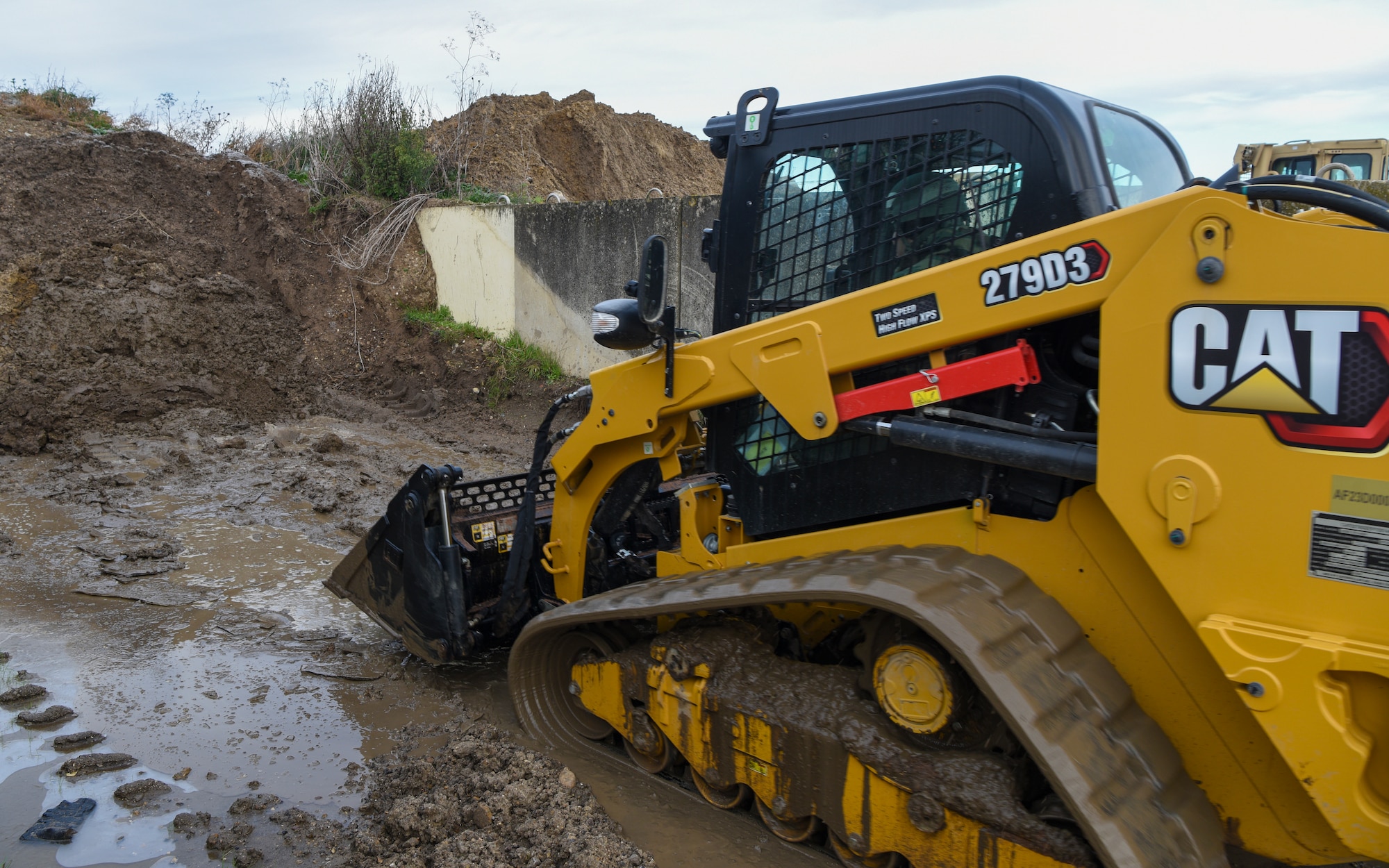 A 100th Civil Engineer Squadron Airman operates a track loader during a Prime Base Engineer Emergency Force (Prime BEEF) readiness day at Royal Air Force Mildenhall, England, Nov. 21, 2024.