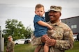 Command Sgt. Maj. Robert C. Render, 103rd Brigade Support Battalion holds his grandson at his retirement in Harrodsburg, Kentucky on June 14, 2024. Render is retiring from the Kentucky Army National Guard with 43 years, and 10 months; he is longest serving member of the Kentucky National Guard. (U.S. Army National Guard photo by Sgt. 1st Class Andrew Dickson)