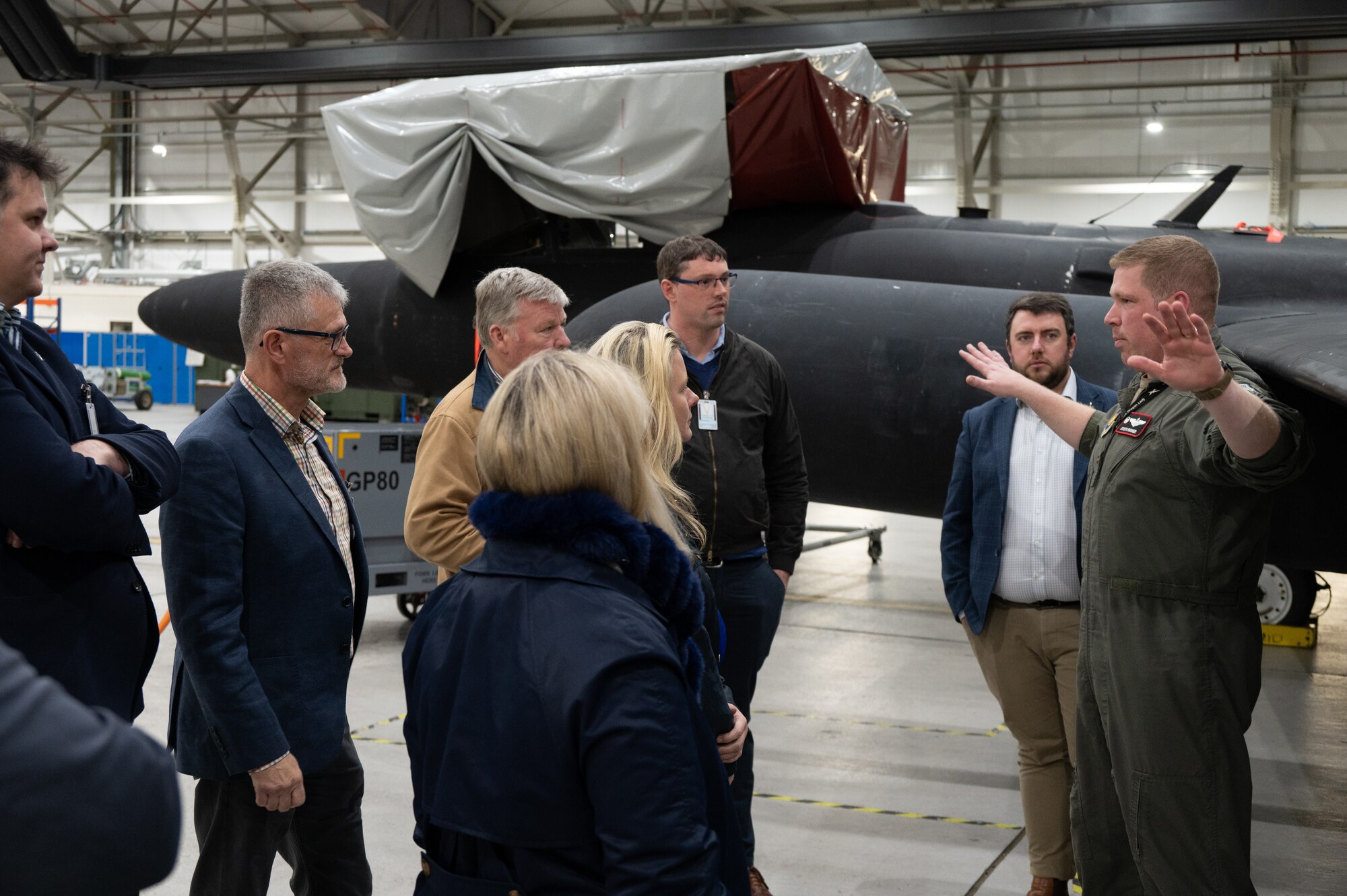 U.S. Air Force Lt. Col. Joseph J. Raisner, 99th Expeditionary Reconnaissance Squadron (ERS) commander, talks with visitors