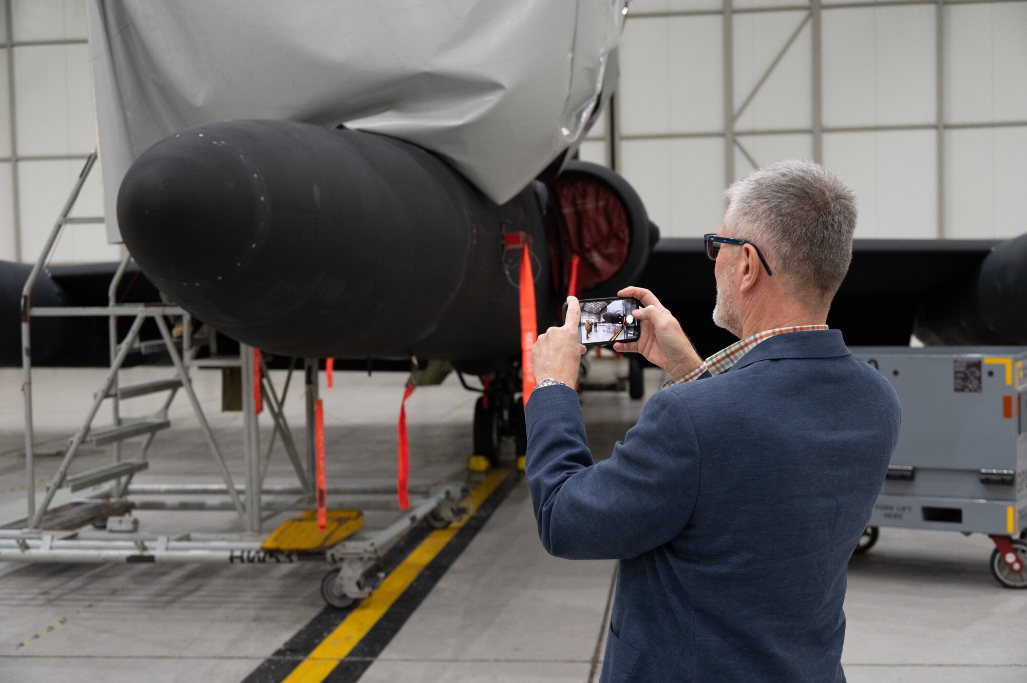 Mr. Kevin Fressan, member of the Spitfire AA810 project, takes a picture