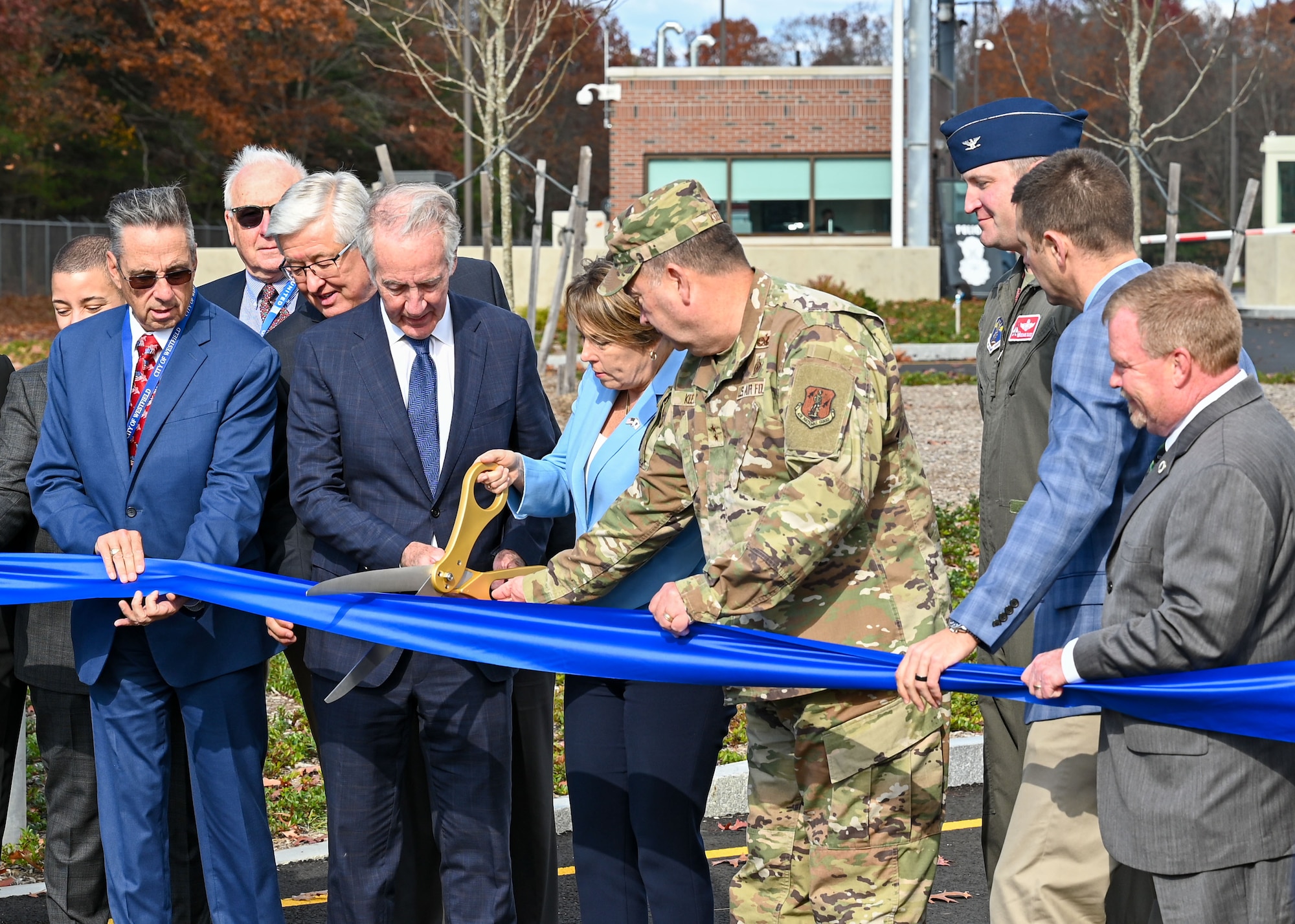Massachusetts Governor Maura Healey cuts the ceremonial ribbon during the 104th Fighter Wing's Minuteman Gate ribbon cutting ceremony, Thursday, November 7, 2024, at Barnes Air National Guard Base, Westfield, Massachusetts. 

Col. David 'Moon' Halasi-Kun, 104FW Commander, deatils the impact of the new Minuteman Gate through its ability to provide the 104FW with additional security as the installation prepares for conversion to the F-35.

"This project was accomplished through the collaboration and commitment from the city of Westfield and the Barnes Airport commission," said Halasi-Kun. "The opening of this gate is the first of many steps preparing this installation for the arrival and operation of the fifth generation F-35 aircraft."

(U.S. Air National Guard photo by Jay Hewitt)