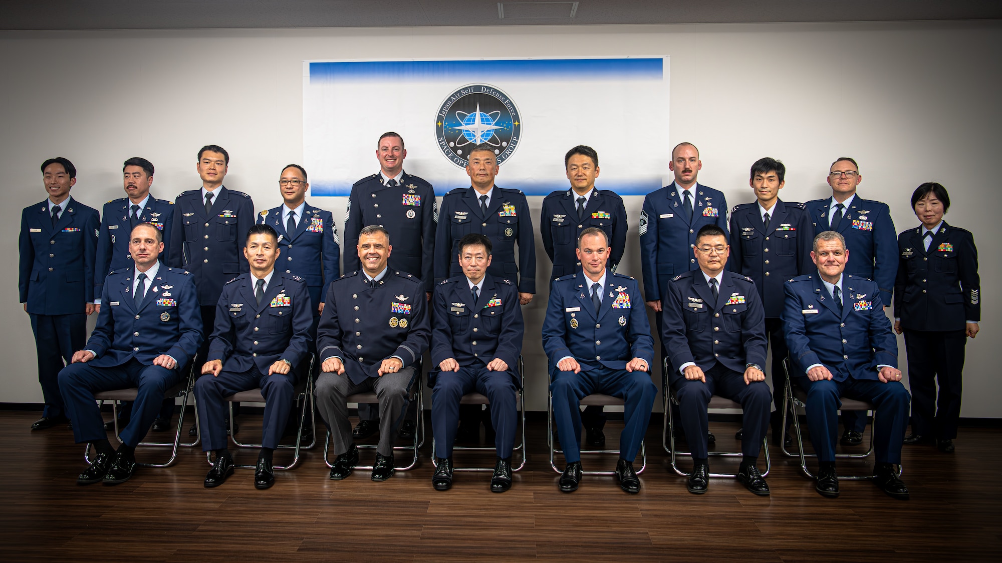 Leaders from the U.S. Space Force and the Japan Air Self-Defense Force pose for a group photo during a Space Force engagement at Fuchu Air Base, Japan, Dec. 2, 2024. The event highlighted activation initiatives and reinforced bilateral cooperation in space operations. (U.S. Air Force photo by Airman 1st Class Cayla Hunt)