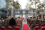 Navy Medicine Readiness and Training Command Camp Pendleton stands at attention during the Pearl Harbor Remembrance Ceremony held in the Naval Hospital Camp Pendleton Medal of Honor Promenade on Friday, Dec. 6, 2024. Planned and executed by the First Class Petty Officer Association, the event honored the 2,403 service members and civilians who died in the attack on the US Naval Base at Pearl Harbor on Dec. 7, 1941.