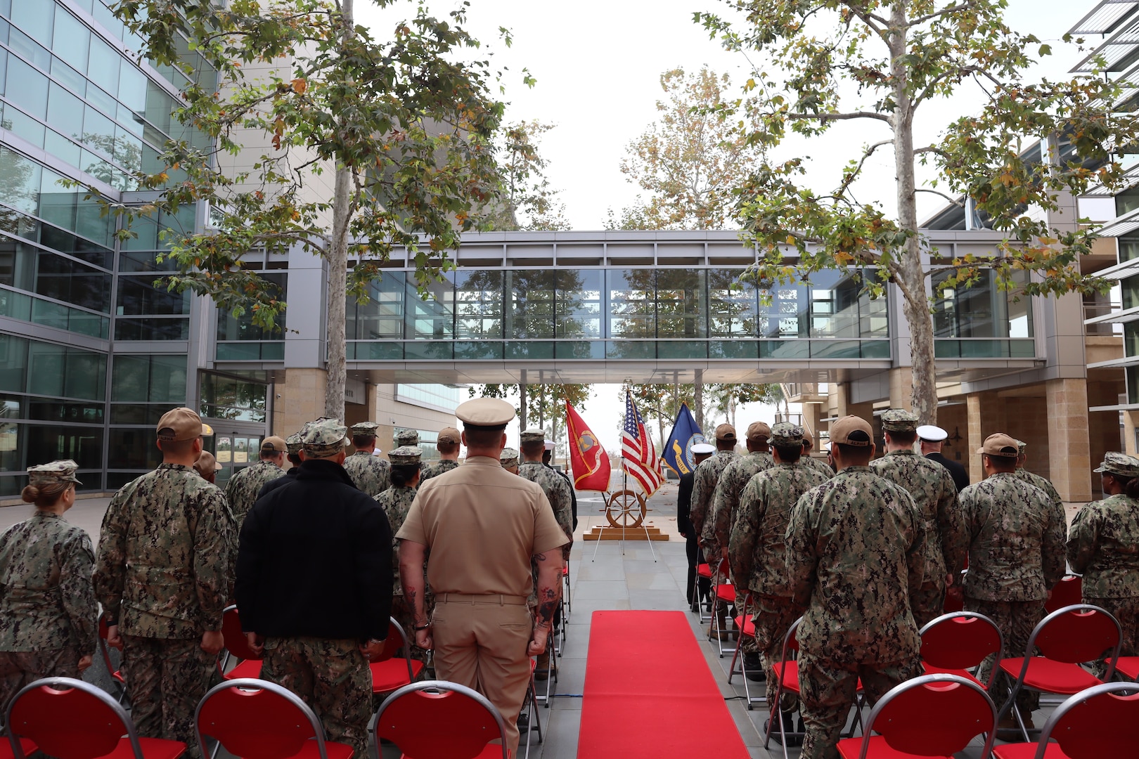 Navy Medicine Readiness and Training Command Camp Pendleton stands at attention during the Pearl Harbor Remembrance Ceremony held in the Naval Hospital Camp Pendleton Medal of Honor Promenade on Friday, Dec. 6, 2024. Planned and executed by the First Class Petty Officer Association, the event honored the 2,403 service members and civilians who died in the attack on the US Naval Base at Pearl Harbor on Dec. 7, 1941.