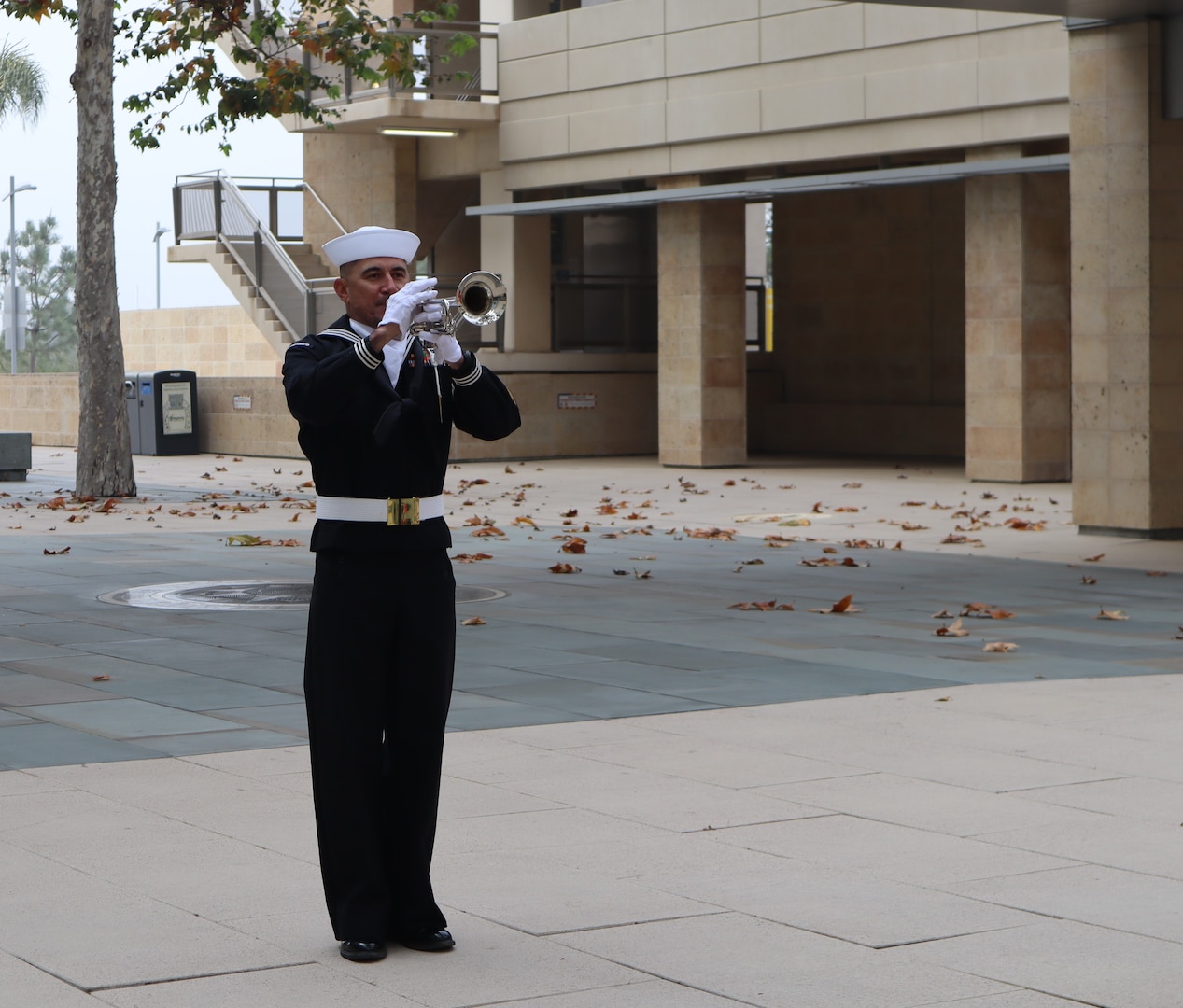 Retired 1st Class Petty Officer Cerbando Ramirez Jr. plays “Taps” during the Navy Medicine Readiness and Training Command Camp Pendleton Pearl Harbor Remembrance Ceremony held in the Naval Hospital Camp Pendleton Medal of Honor Promenade on Friday, Dec. 6, 2024. Ramirez served as a machinist mate during his Navy career and often volunteers his time to play “Taps” during NMRTC CP events and ceremonies. Planned and executed by the First Class Petty Officer Association, the event honored the 2,403 service members and civilians who died in the attack on the US Naval Base at Pearl Harbor on Dec. 7, 1941.