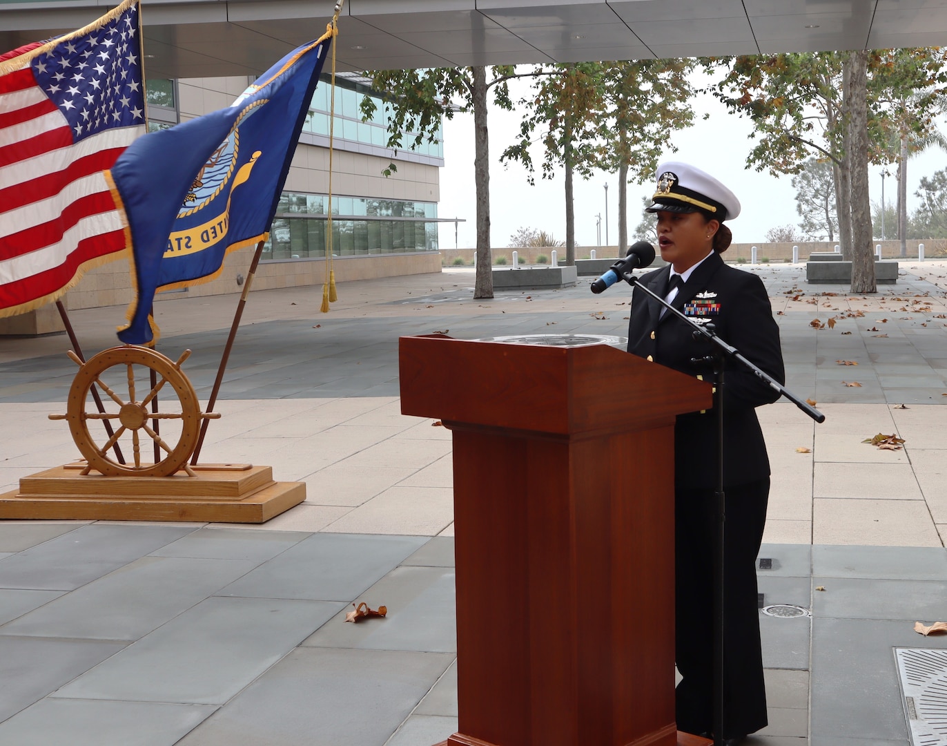 Ensign Grace Joan Reveles sings the National Anthem during the Navy Medicine Readiness and Training Command Camp Pendleton Pearl Harbor Remembrance Ceremony held in the Naval Hospital Camp Pendleton Medal of Honor Promenade on Friday, Dec. 6, 2024. Reveles, a prior enlisted Sailor from the hospital, was commissioned earlier this year and is a member of the hospital nursing staff. Planned and executed by the First Class Petty Officer Association, the event honored the 2,403 service members and civilians who died in the attack on the US Naval Base at Pearl Harbor on Dec. 7, 1941.