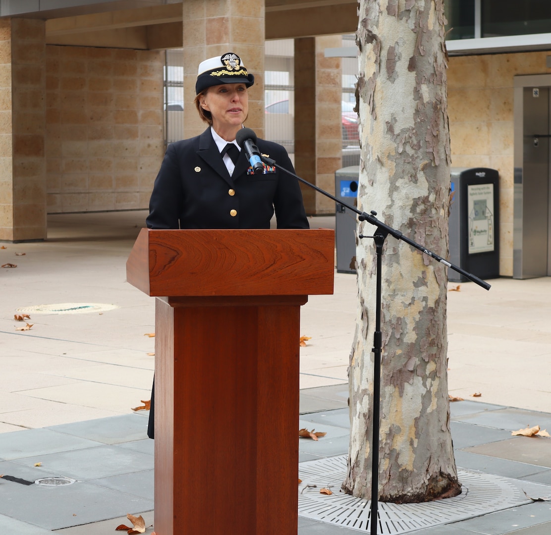 Navy Capt. Jenny Burkett, commander of Navy Medicine Readiness and Training Command Camp Pendleton, provides closing comments during the NMRTC CP Pearl Harbor Remembrance Ceremony held in the Naval Hospital Camp Pendleton Medal of Honor Promenade on Friday, Dec. 6, 2024. “As we remember Pearl Harbor, let us commit ourselves to honoring the legacy of those who served and sacrificed. Let their stories inspire us to work for a more peaceful and just world, ensuring their sacrifices were not in vain,” said Burkett during her comments. Planned and executed by the First Class Petty Officer Association, the event honored the 2,403 service members and civilians who died in the attack on the US Naval Base at Pearl Harbor on Dec. 7, 1941.