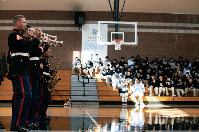 U.S. Marines with Marine Band San Diego, Headquarters and Service Battalion, Marine Corps Recruit Depot San Diego, perform for students at Salesian High School in Los Angeles, California, Nov. 20, 2024. The Marine Band San Diego’s job is to provide ceremonial music, boost morale and participate in outreach work and attend events and ceremonies. (U.S. Marine Corps photo by Cpl. Sarah M. Grawcock)