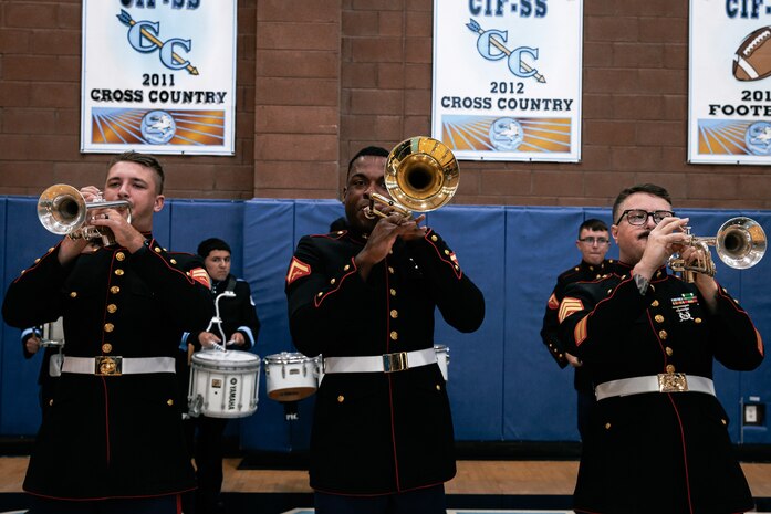 U.S. Marines with Marine Band San Diego, Headquarters and Service Battalion, Marine Corps Recruit Depot San Diego, perform for students at Salesian High School in Los Angeles, California, Nov. 20, 2024. The Marine Band San Diego’s job is to provide ceremonial music, boost morale and participate in outreach work and attend events and ceremonies. (U.S. Marine Corps photo by Cpl. Sarah M. Grawcock)