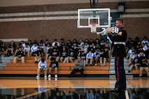 U.S. Marine Corps Cpl. Jacob Daniels, trumpeter, with Marine Band San Diego, Headquarters and Service Battalion, MCRD San Diego, performs for students at Salesian High School in Los Angeles, California, Nov. 20, 2024. The Marine Band San Diego’s job is to provide ceremonial music, boost morale and participate in outreach work and attend events and ceremonies. (U.S. Marine Corps photo by Cpl. Sarah M. Grawcock)