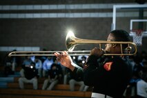 U.S. Marine Corps Lance Cpl. Chandler Ash, trombonist with Marine Band San Diego, Headquarters and Service Battalion, Marine Corps Recruit Depot San Diego, performs for students at Salesian High School in Los Angeles, California, Nov. 20, 2024. The Marine Band San Diego’s job is to provide ceremonial music, boost morale and participate in outreach work and attend events and ceremonies. (U.S. Marine Corps photo by Cpl. Sarah M. Grawcock)