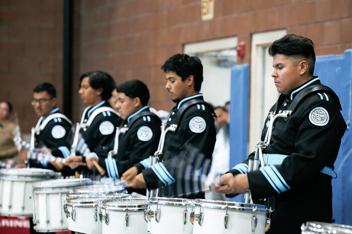 Students from Salesian High School perform for U.S. Marines with Marine Band San Diego, Headquarters and Service Battalion, MCRD San Diego, in Los Angeles, California, Nov. 20, 2024. The Marine Band San Diego’s job is to provide ceremonial music, boost morale and participate in outreach work and attend events and ceremonies. (U.S. Marine Corps photo by Cpl. Sarah M. Grawcock)
