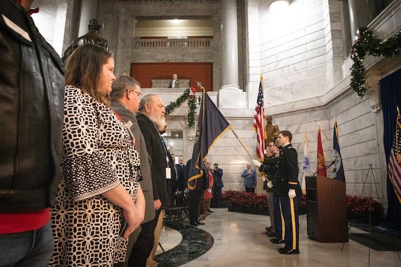 Soldiers from the 63rd Theater Aviation Brigade provide color guard support at the Kentucky Department of Veterans Affairs wreath laying ceremony at the Capitol Rotunda in Frankfort, Kentucky on Dec. 9, 2024. The Kentucky National Guard supported the ceremony by providing music from the 202nd Band and a color guard from the 63rd Theater Aviation Brigade. (U.S. Army National Guard photo by Andy Dickson)