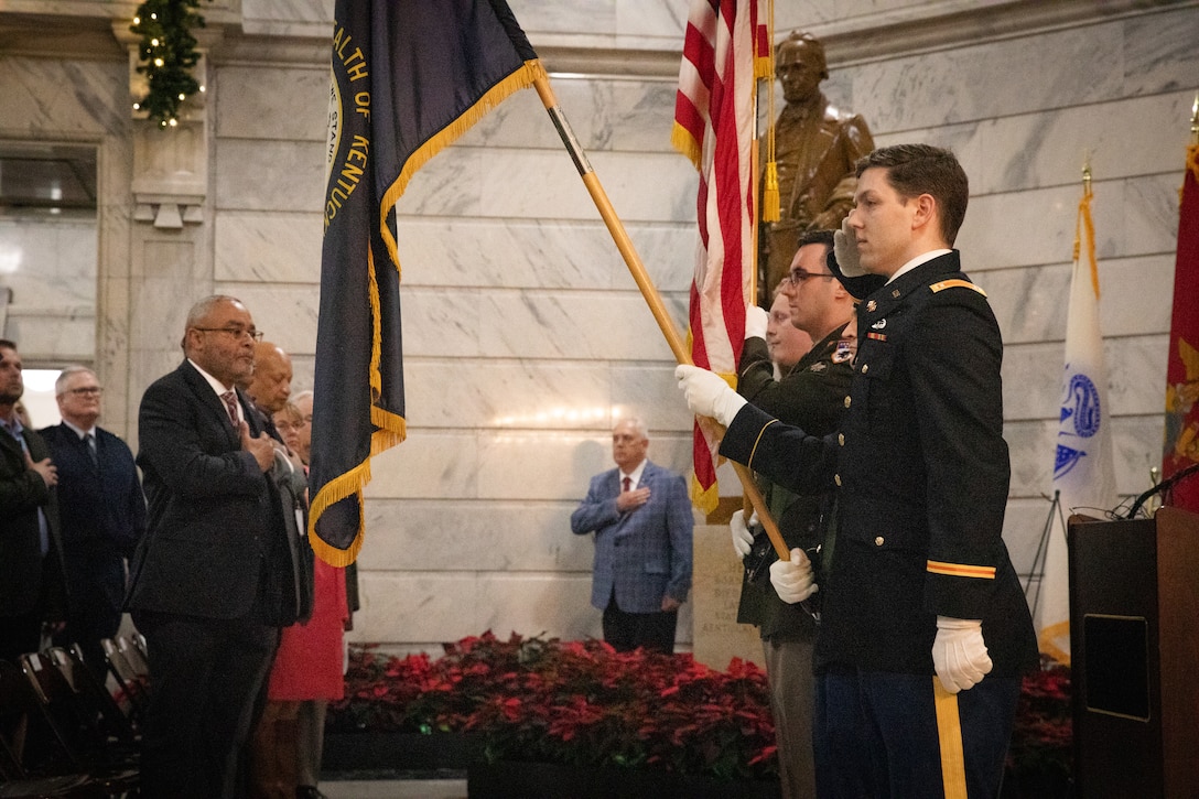 Soldiers from the 63rd Theater Aviation Brigade provide color guard support at the Kentucky Department of Veterans Affairs wreath laying ceremony at the Capitol Rotunda in Frankfort, Kentucky on Dec. 9, 2024. The Kentucky National Guard supported the ceremony by providing music from the 202nd Band and a color guard from the 63rd Theater Aviation Brigade. (U.S. Army National Guard photo by Andy Dickson)