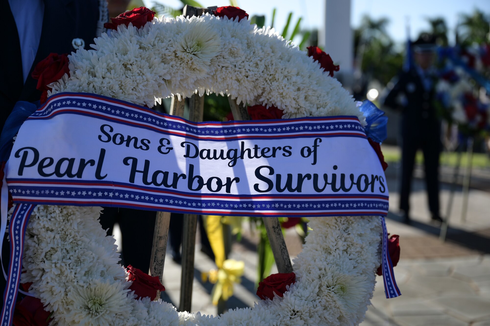 A wreath is displayed during a ceremony.