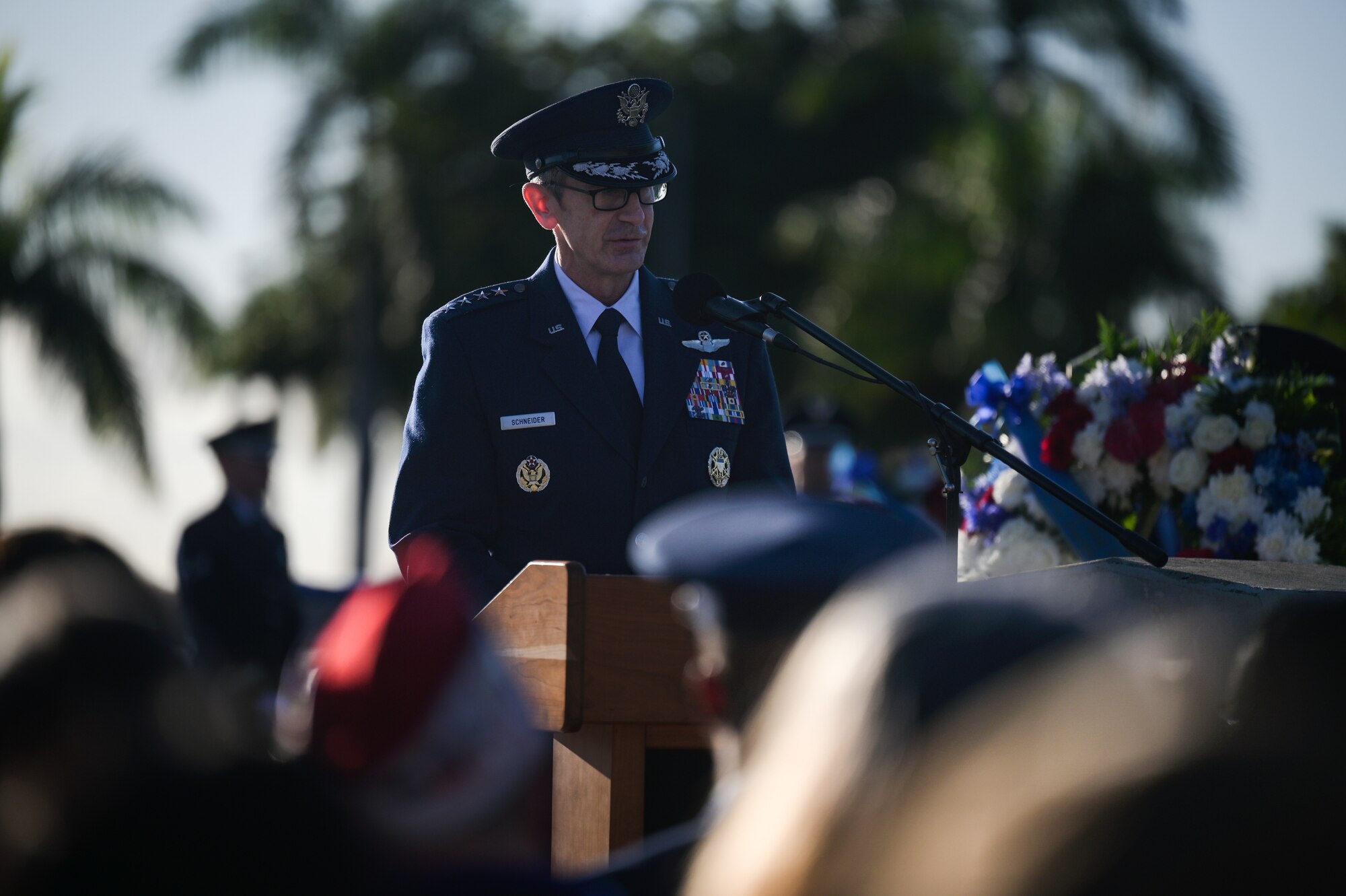 Airman speaks during a ceremony.