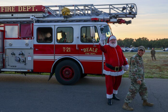 Santa Claus and U.S. Air Force Capt. Peter Vo, 9th Reconnaissance Wing chaplain, attend the annual Christmas Tree lighting at Beale Air Force Base, California, Dec. 6, 2024.
