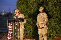 U.S. Air Force Capt. Peter Vo, 9th Reconnaissance Wing (RW) chaplain, leads the invocation along with Airman 1st Class Gertrude Namata, 9th RW chaplain assistant, during the annual Christmas Tree lighting at Beale Air Force Base, California, Dec. 6, 2024