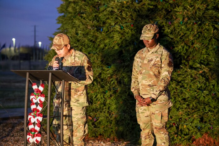 U.S. Air Force Capt. Peter Vo, 9th Reconnaissance Wing (RW) chaplain, leads the invocation along with Airman 1st Class Gertrude Namata, 9th RW chaplain assistant, during the annual Christmas Tree lighting at Beale Air Force Base, California, Dec. 6, 2024