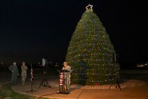 U.S. Air Force Capt. Peter Vo, 9th Reconnaissance Wing chaplain, speaks to the audience after officially lighting the tree during the annual Christmas Tree lighting at Beale Air Force Base, California, Dec. 6, 2024.