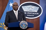 Secretary of Defense Lloyd J. Austin III stands in the Pentagon Press Briefing Room