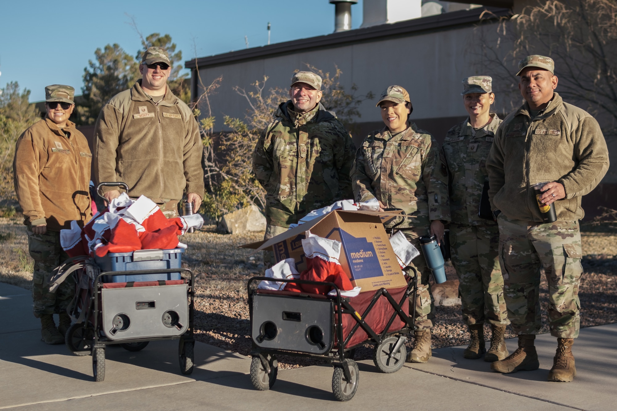 Members of the First Sergeant Council pose for a photo before distributing donations as part of the annual Airmen cookie drive at Holloman Air Force Base, New Mexico.