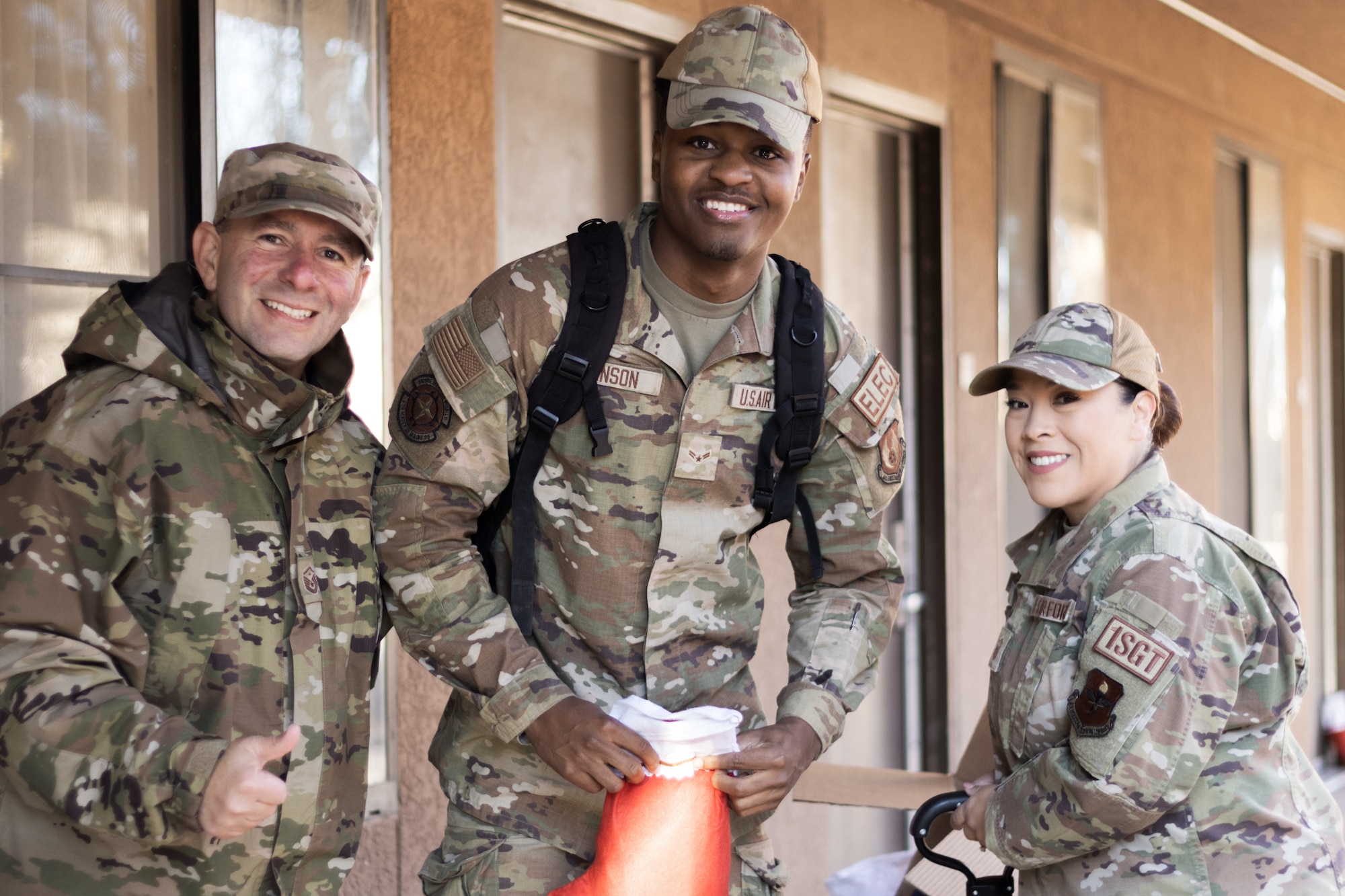 Holloman Airman receives a stocking full of cookies from various first sergeants.