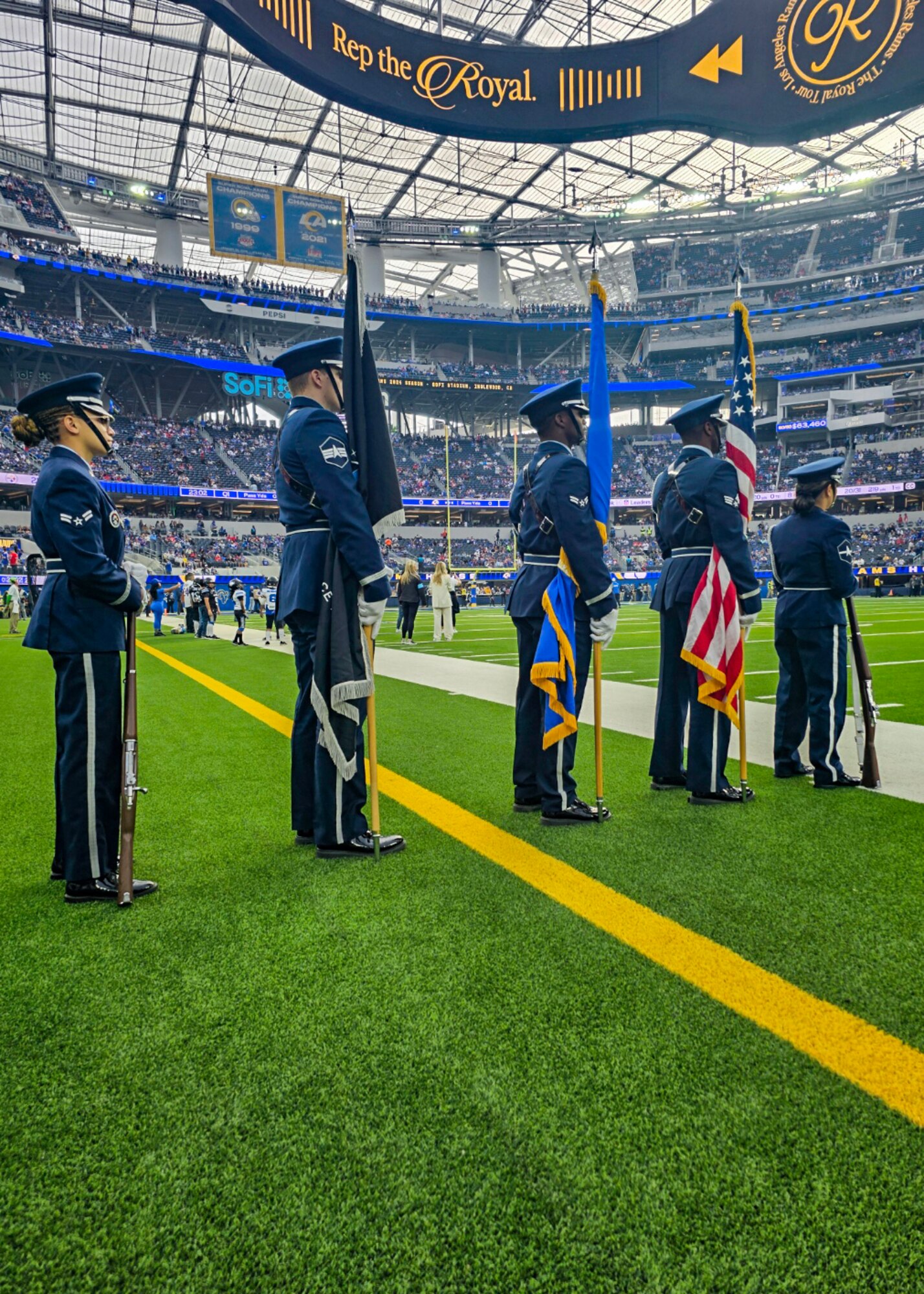 The Vandenberg Space Force Base Honor Guard awaits the command to present the colors during the national anthem prior to a Los Angeles Rams home game in Inglewood, Calif.