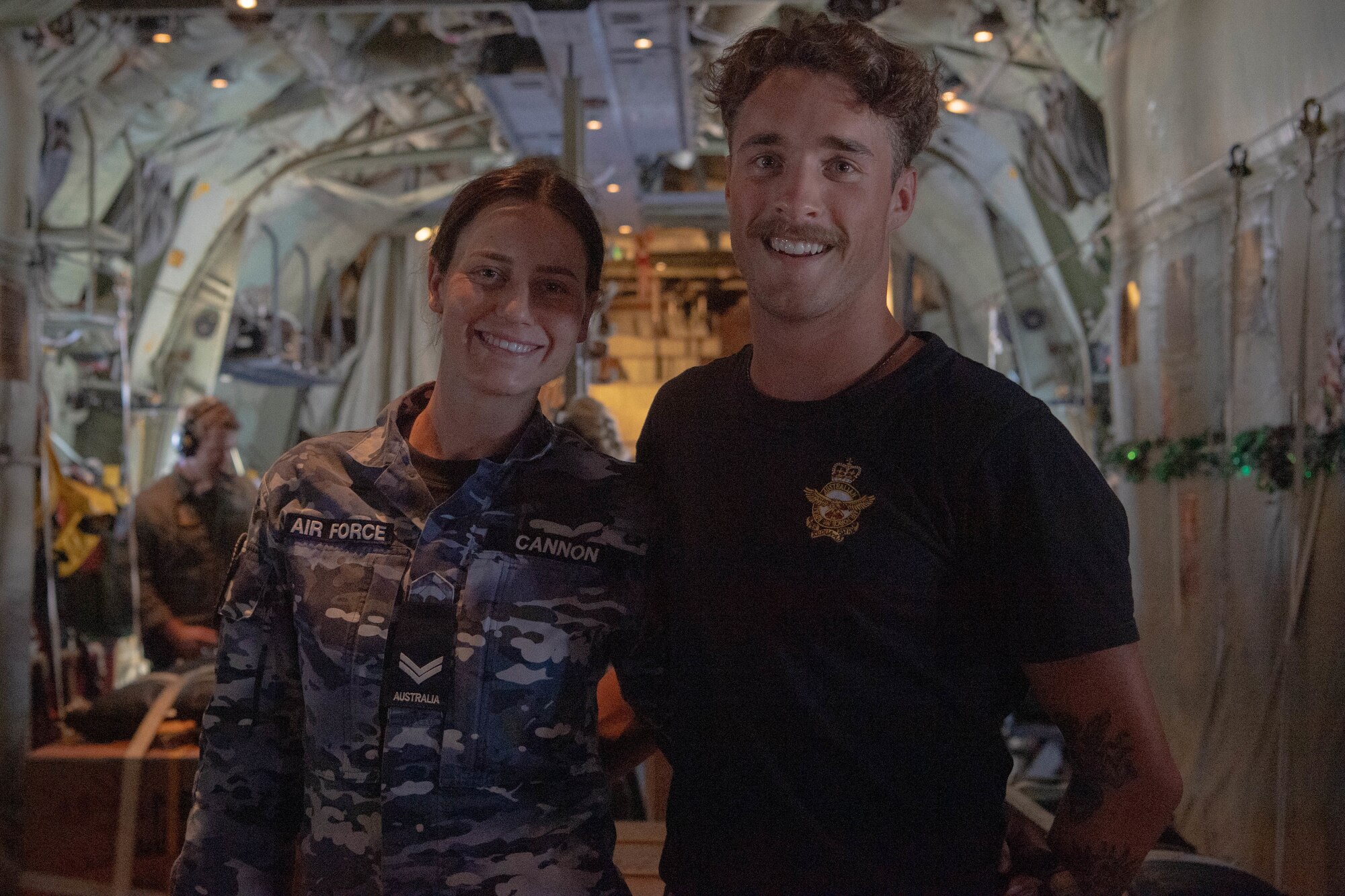 Two Airmen pose for a photo.